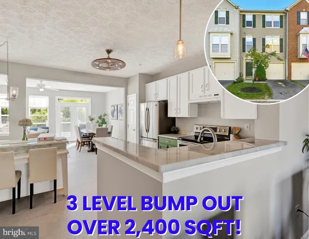 a view of a hallway with windows and stairs