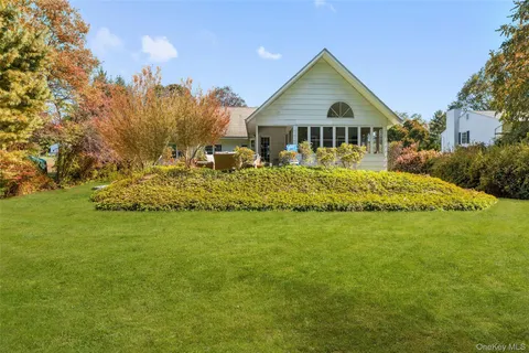 a front of a house with a garden