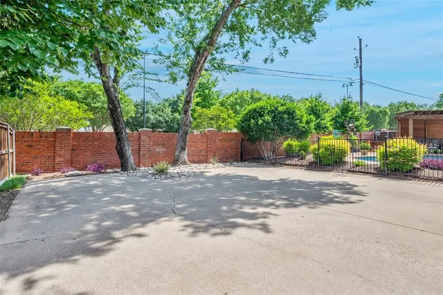 a couple of potted plants sitting in front of a house