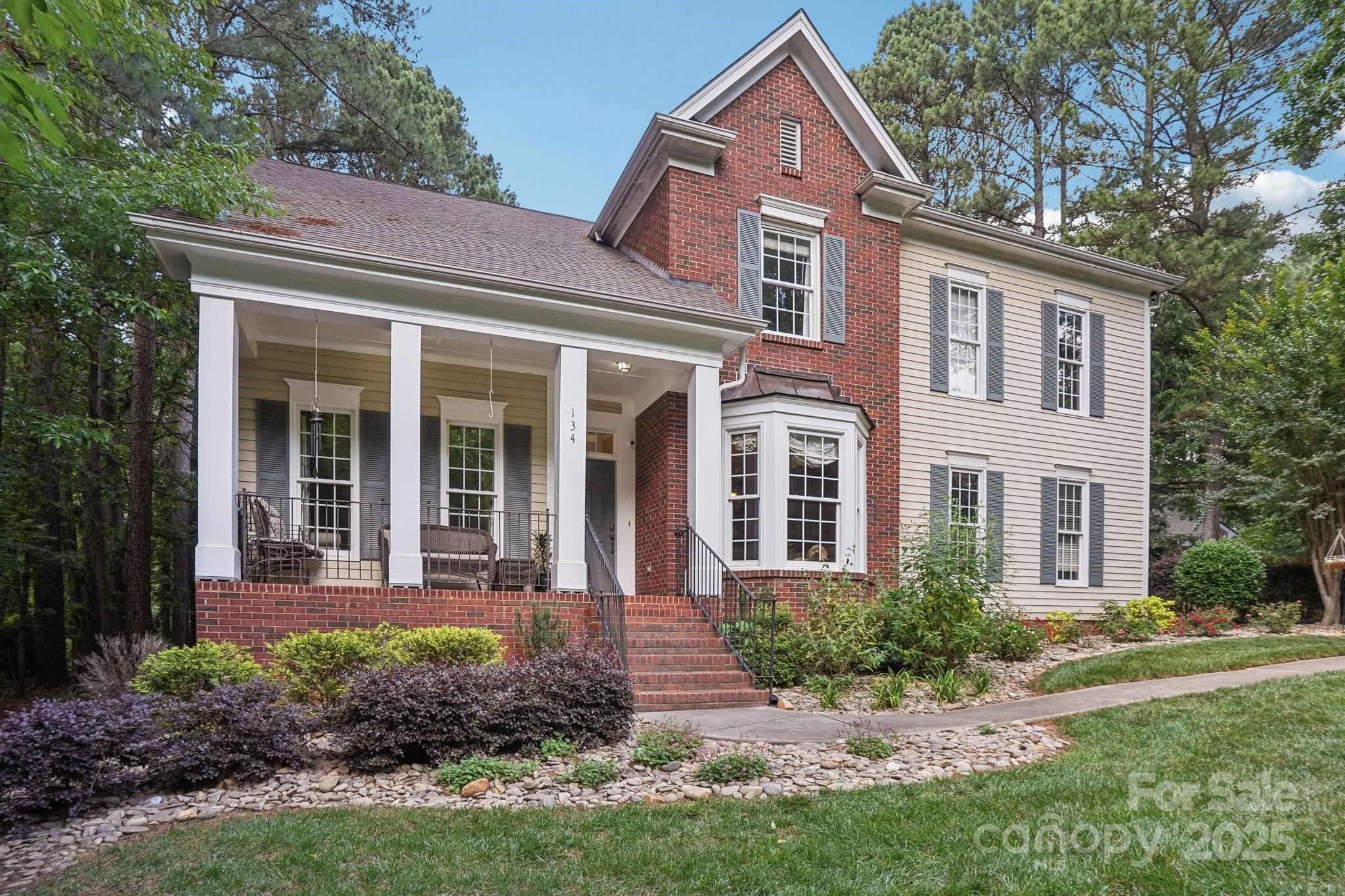 134 Lake Spring Loop Mooresville, NC 28117 - Photo 1 of 36 front view of a house with a yard