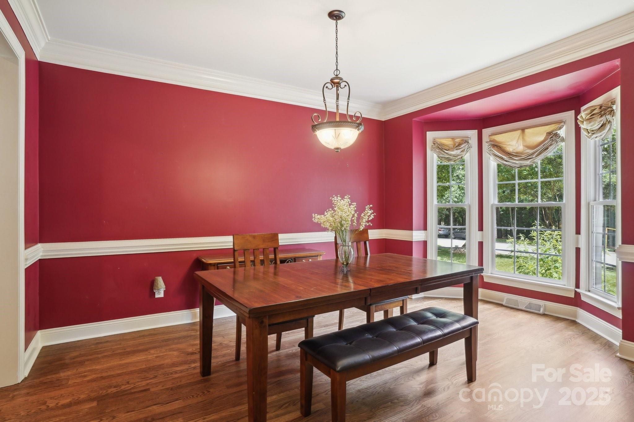 134 Lake Spring Loop Mooresville, NC 28117 - Photo 15 of 36 a view of a dining room with furniture window and outside view