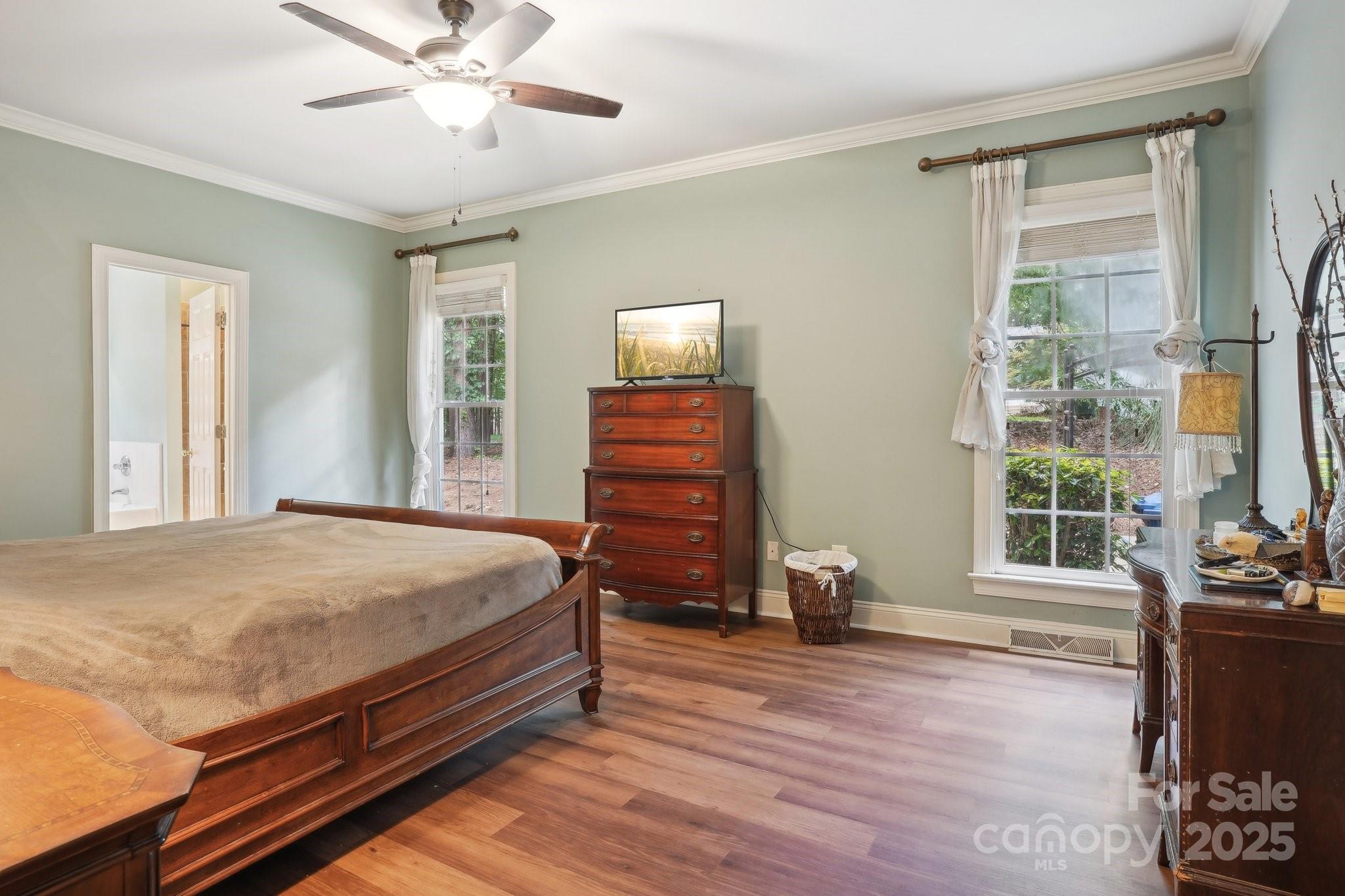 134 Lake Spring Loop Mooresville, NC 28117 - Photo 18 of 36 a bedroom with a bed and wooden floor