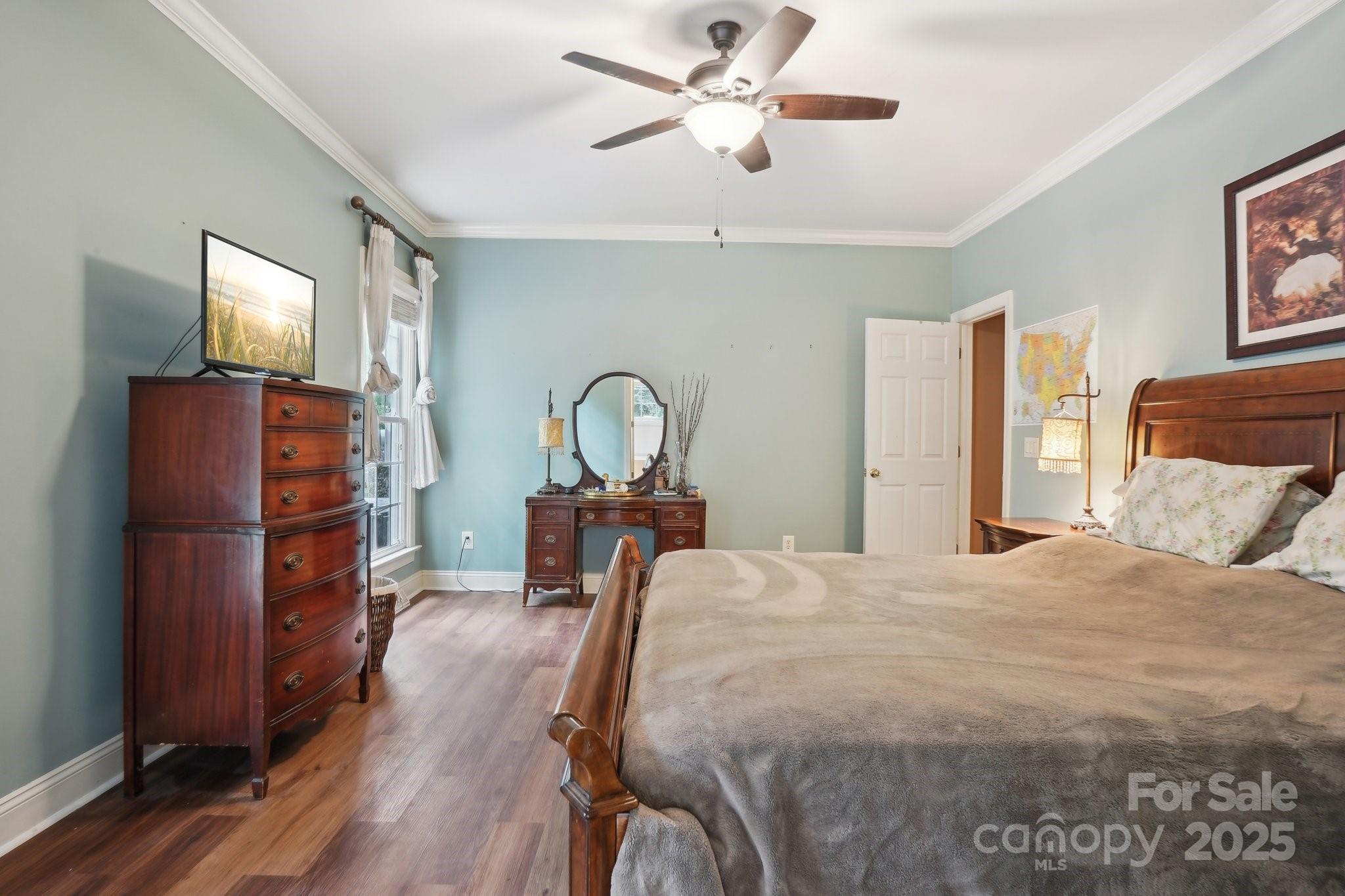 134 Lake Spring Loop Mooresville, NC 28117 - Photo 19 of 36 a bedroom with a bed and a mirror on the dresser