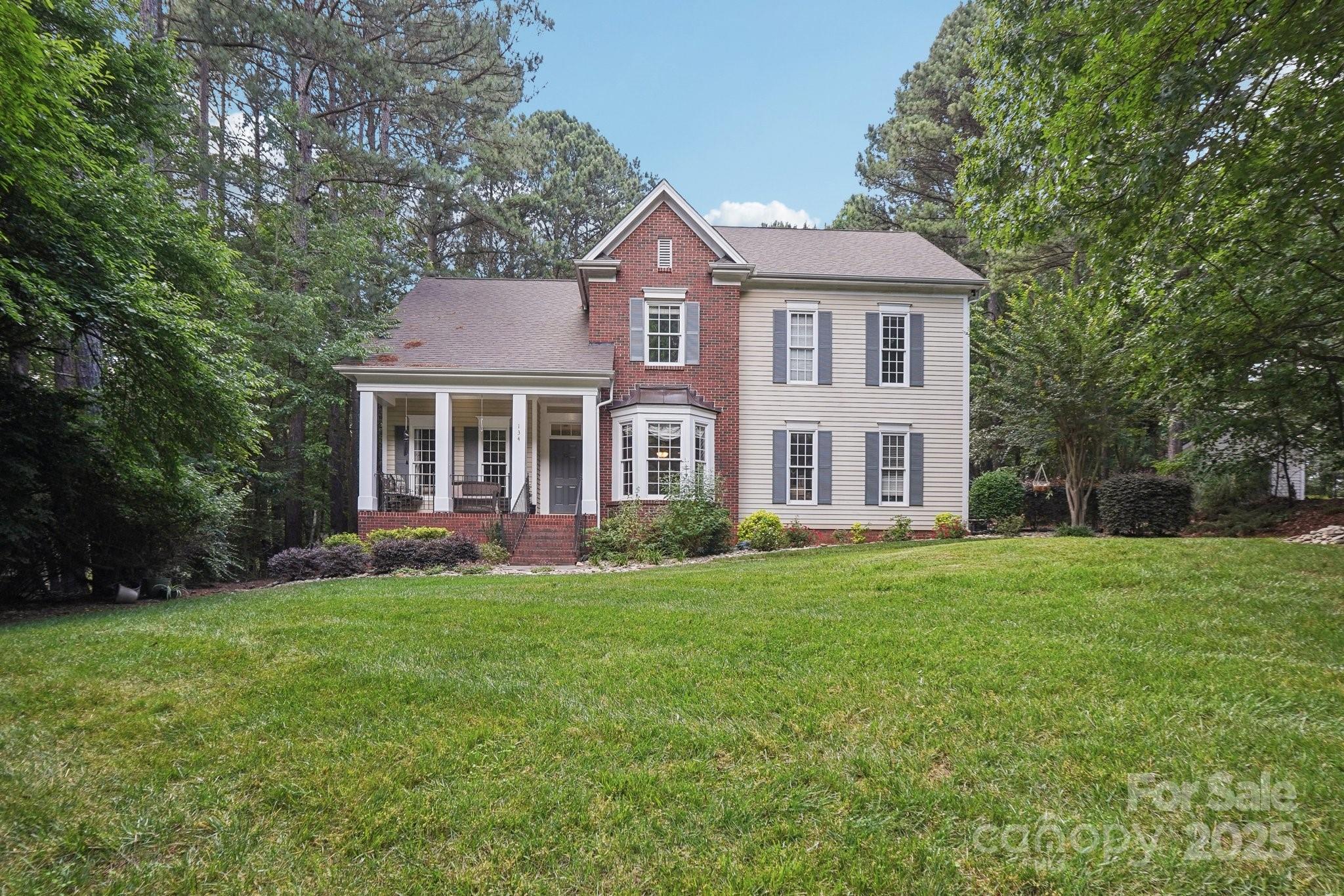 134 Lake Spring Loop Mooresville, NC 28117 - Photo 2 of 36 front view of a house and a yard