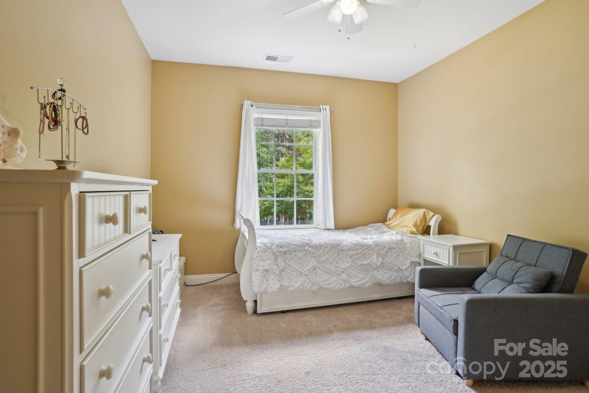 134 Lake Spring Loop Mooresville, NC 28117 - Photo 24 of 36 a bed room with a bed and a couch