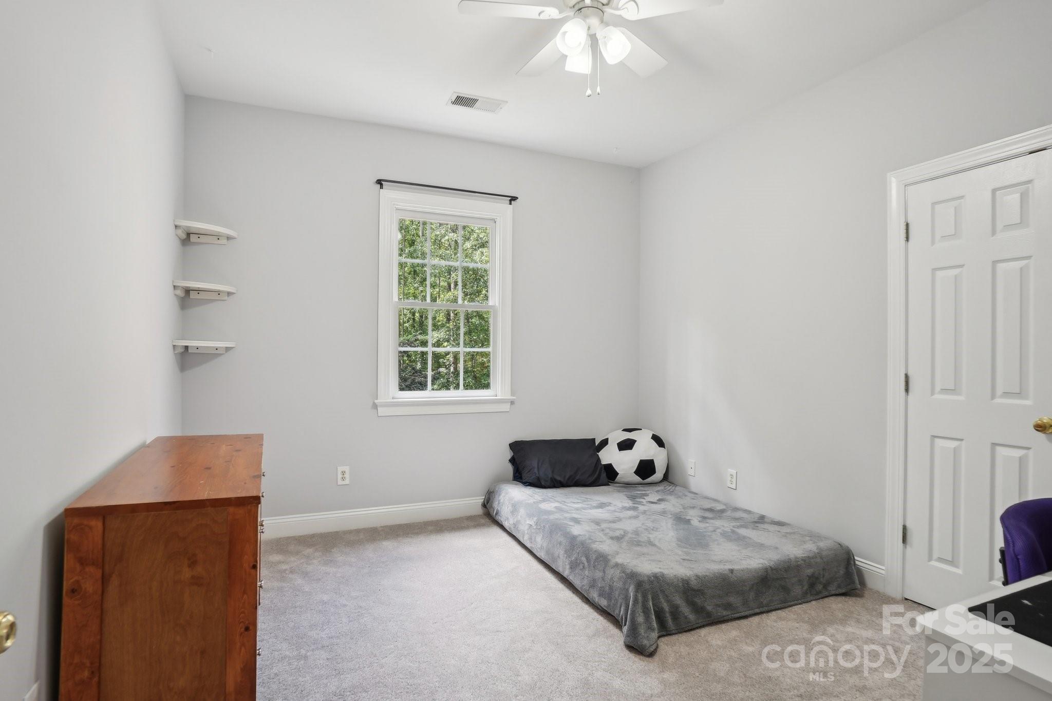 134 Lake Spring Loop Mooresville, NC 28117 - Photo 25 of 36 a living room with furniture and a window