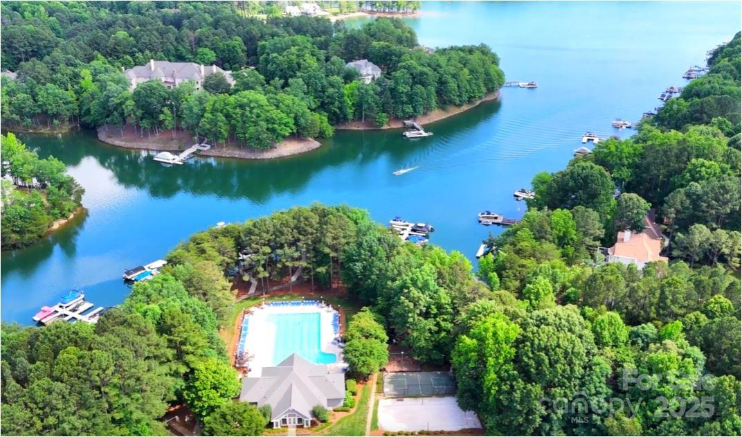 134 Lake Spring Loop Mooresville, NC 28117 - Photo 3 of 36 an aerial view of a house with a garden and lake view