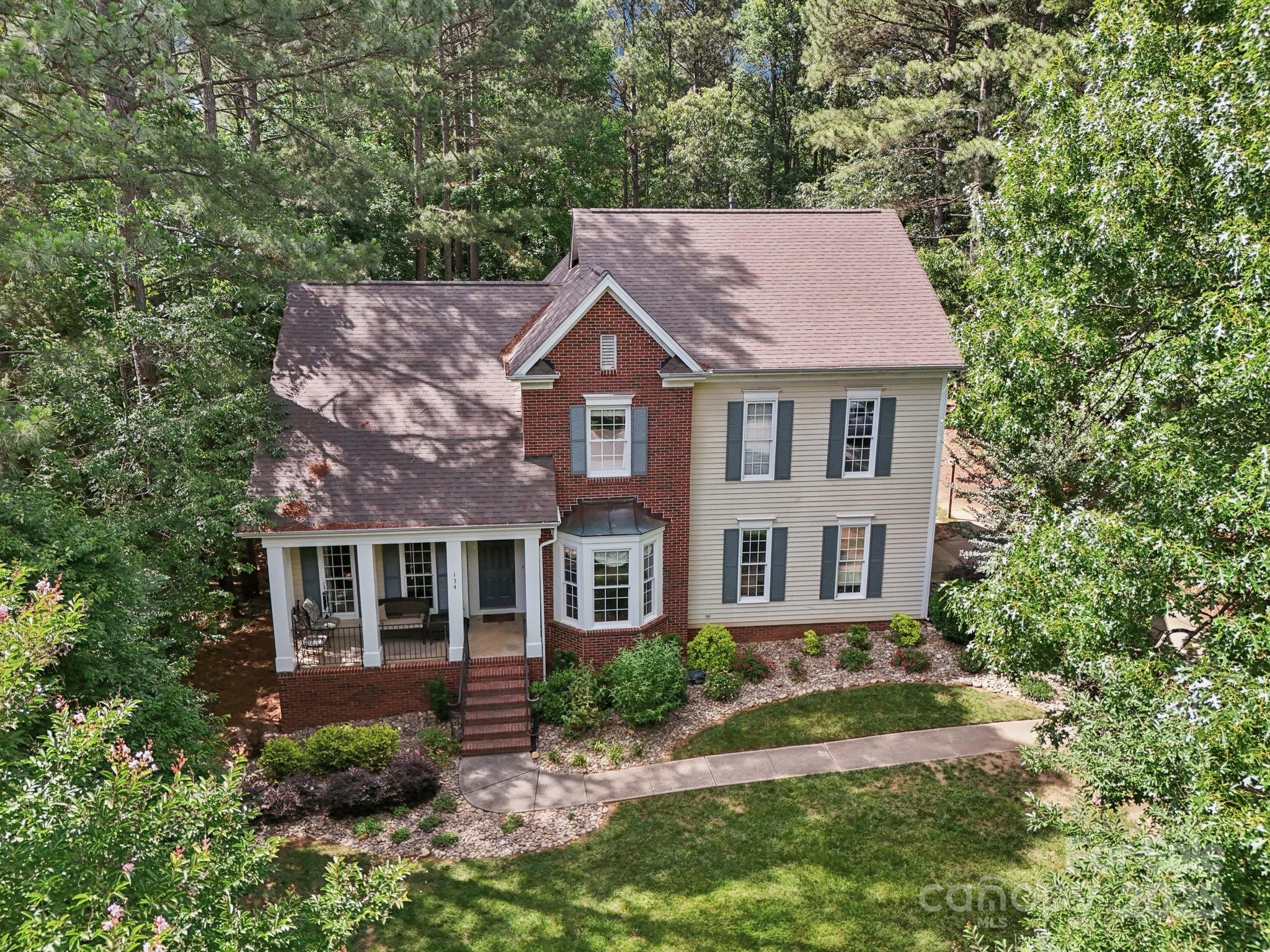 134 Lake Spring Loop Mooresville, NC 28117 - Photo 35 of 36 front view of a house with a yard