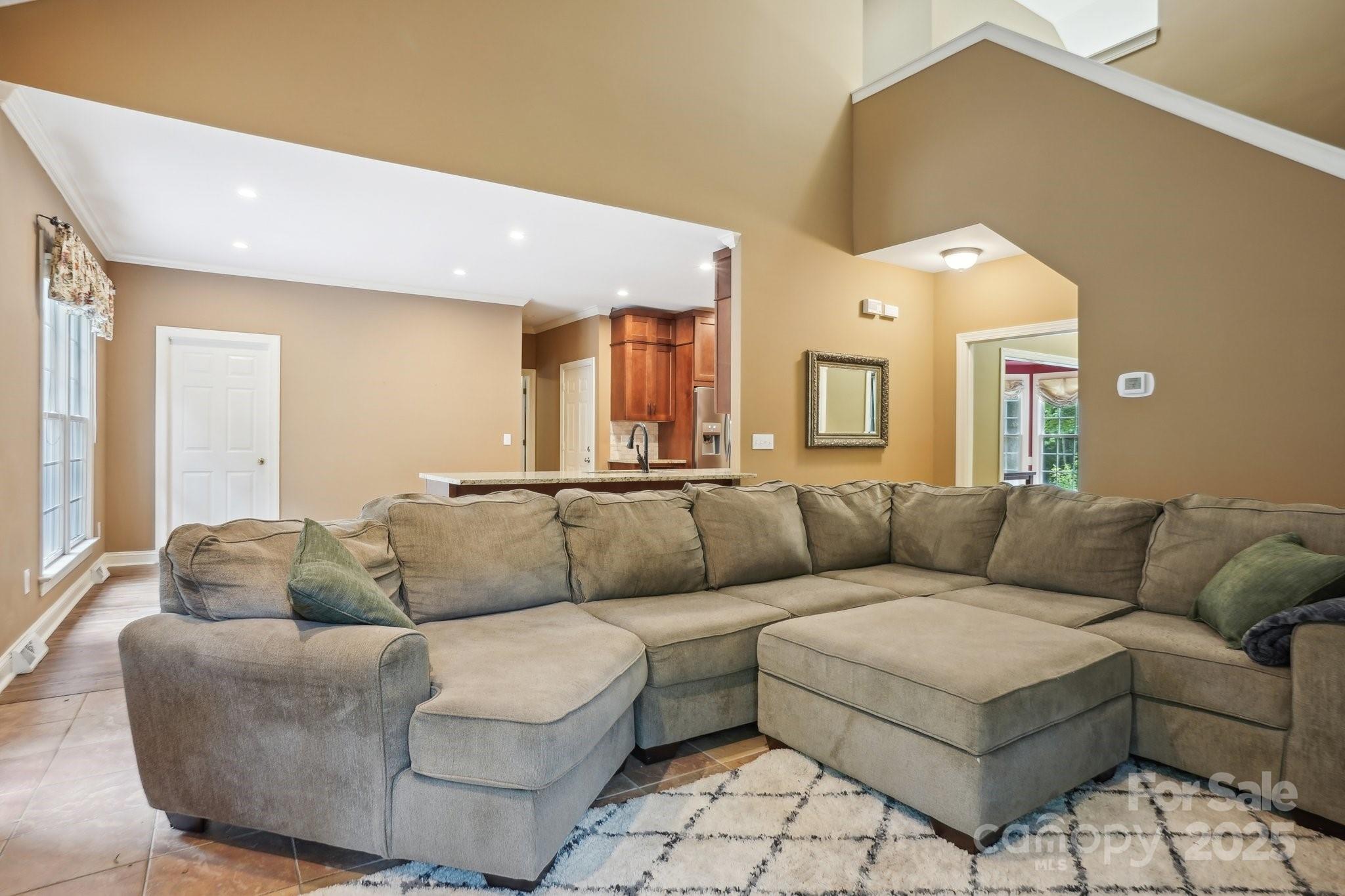 134 Lake Spring Loop Mooresville, NC 28117 - Photo 7 of 36 a living room with furniture and a couch