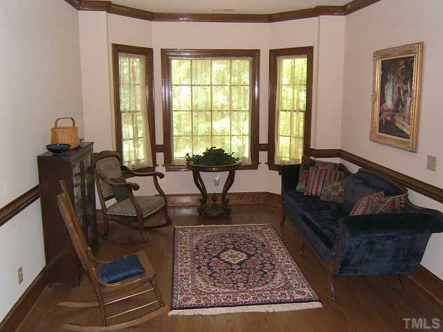 1908 Partridge Berry Drive Raleigh, NC 27606 - Photo 11 of 12 Loft area at the top of the stair landing with bay window overlooking wooded view perfect for a reading nook. Loft