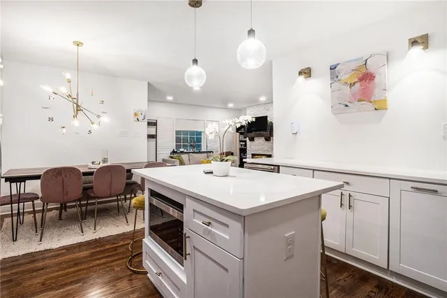 a view of kitchen island with furniture and wooden floor