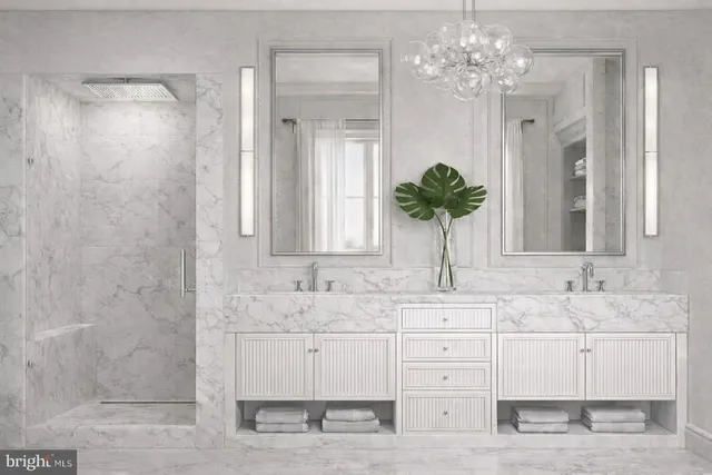 a bathroom with a sink a large mirror and a shower