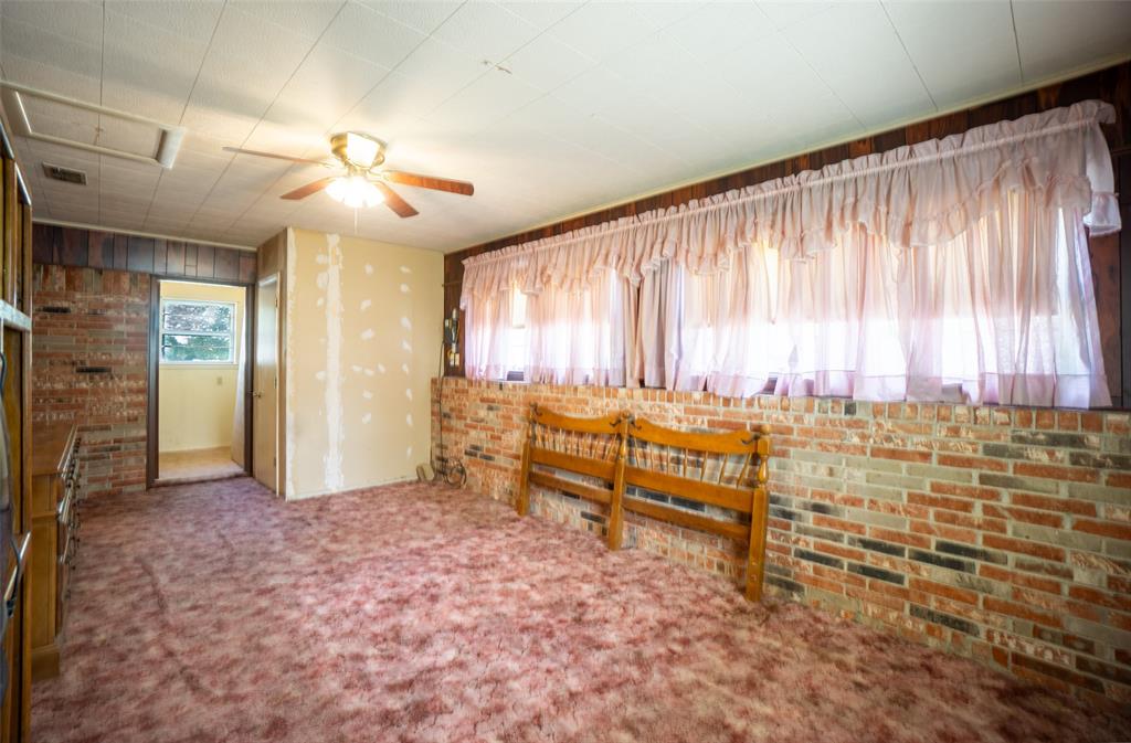 22330 State Highway 64 Canton, TX 75103 - Photo 12 of 33 an empty room with windows and ceiling fan