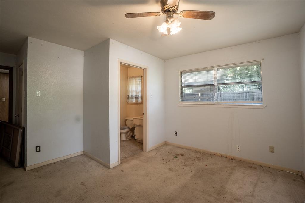 22330 State Highway 64 Canton, TX 75103 - Photo 17 of 33 an empty room with windows and fan