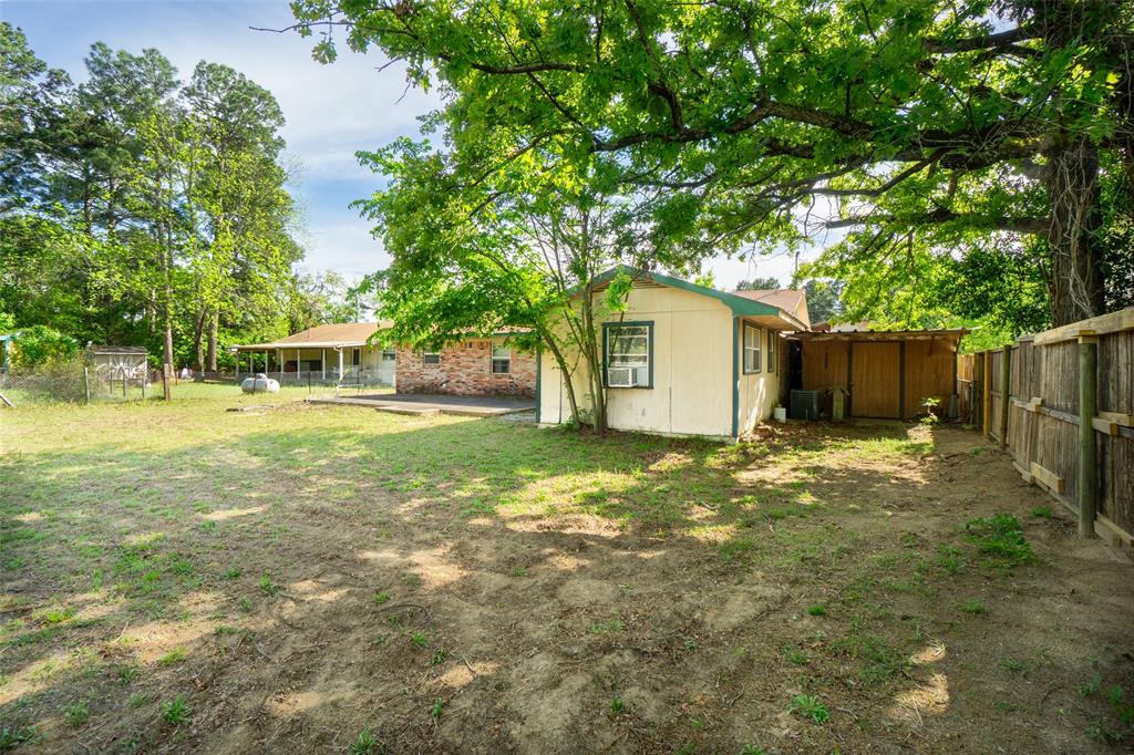 22330 State Highway 64 Canton, TX 75103 - Photo 22 of 33 a view of a house with backyard and a tree