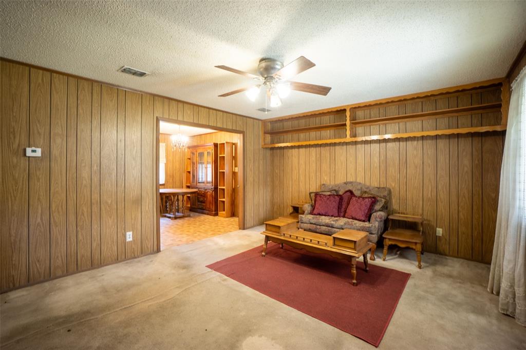 22330 State Highway 64 Canton, TX 75103 - Photo 3 of 33 a living room with furniture and a chandelier