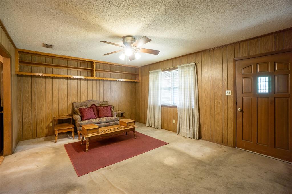 22330 State Highway 64 Canton, TX 75103 - Photo 4 of 33 a bedroom with a bed and a chandelier