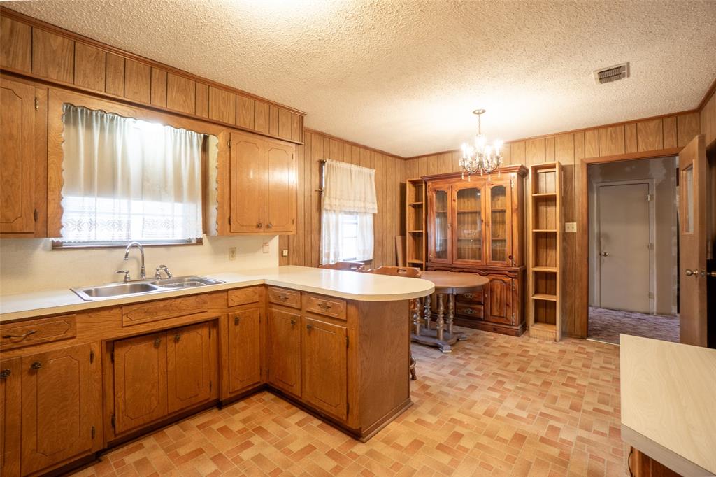 22330 State Highway 64 Canton, TX 75103 - Photo 9 of 33 a kitchen with a sink and cabinets