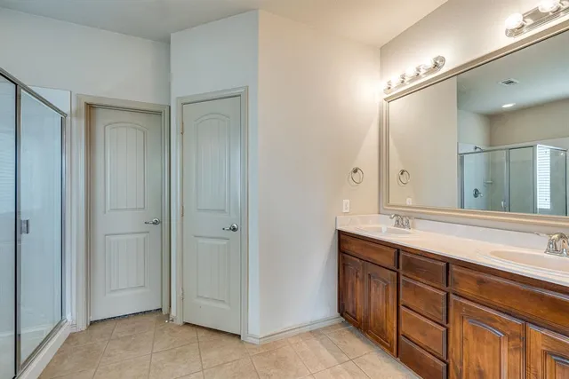 a bathroom with a sink a vanity and a mirror