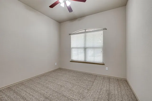 an empty room with closet area