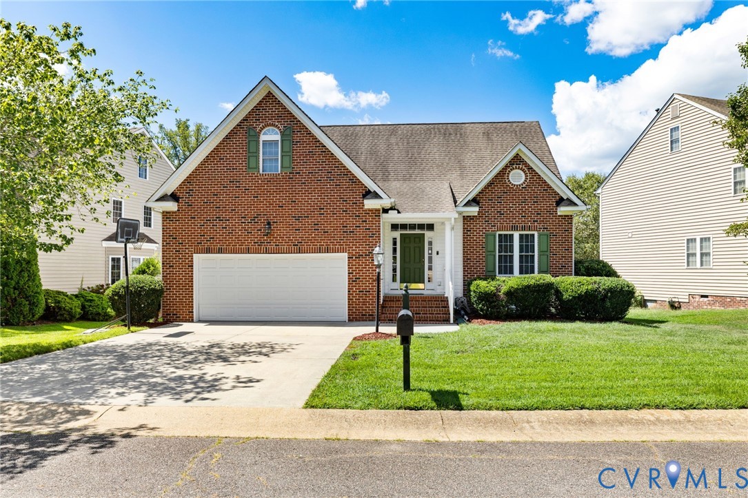 14225 Camack Trail Midlothian, VA 23114 - Photo 1 of 27 a front view of a house with a yard and garage