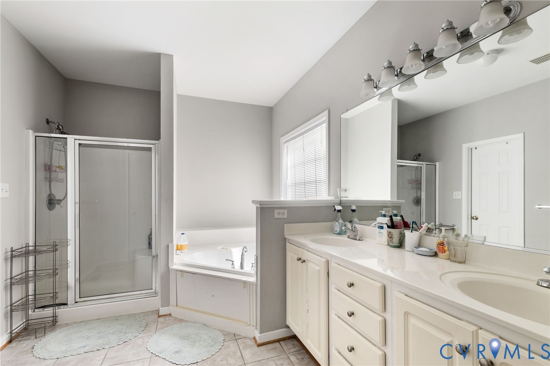 14225 Camack Trail Midlothian, VA 23114 - Photo 18 of 27 a bathroom with a tub sink and mirror