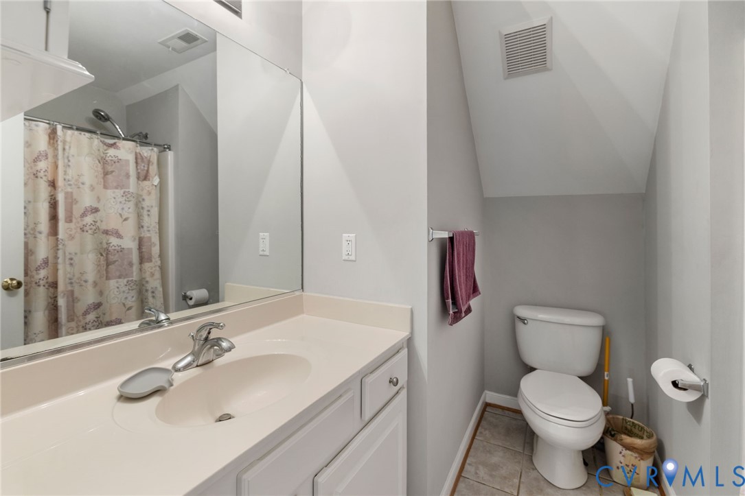 14225 Camack Trail Midlothian, VA 23114 - Photo 23 of 27 a bathroom with a sink toilet and shower