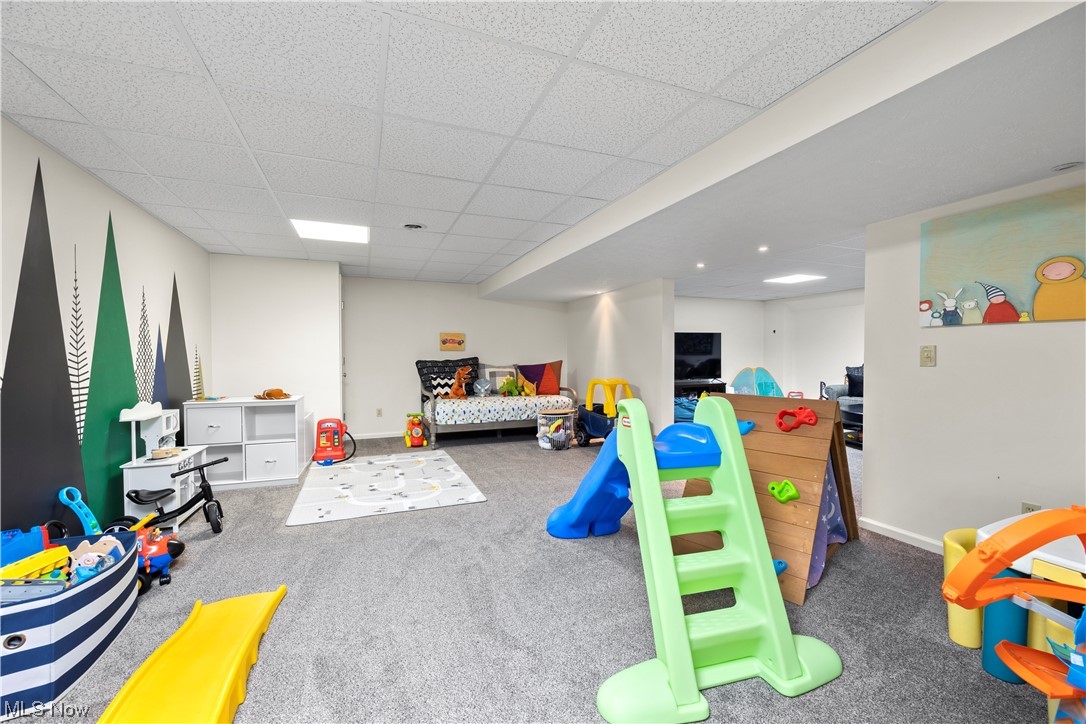 2097 Butler Road Wakeman, OH 44889 - Photo 27 of 34 Game room featuring carpet floors and a drop ceiling