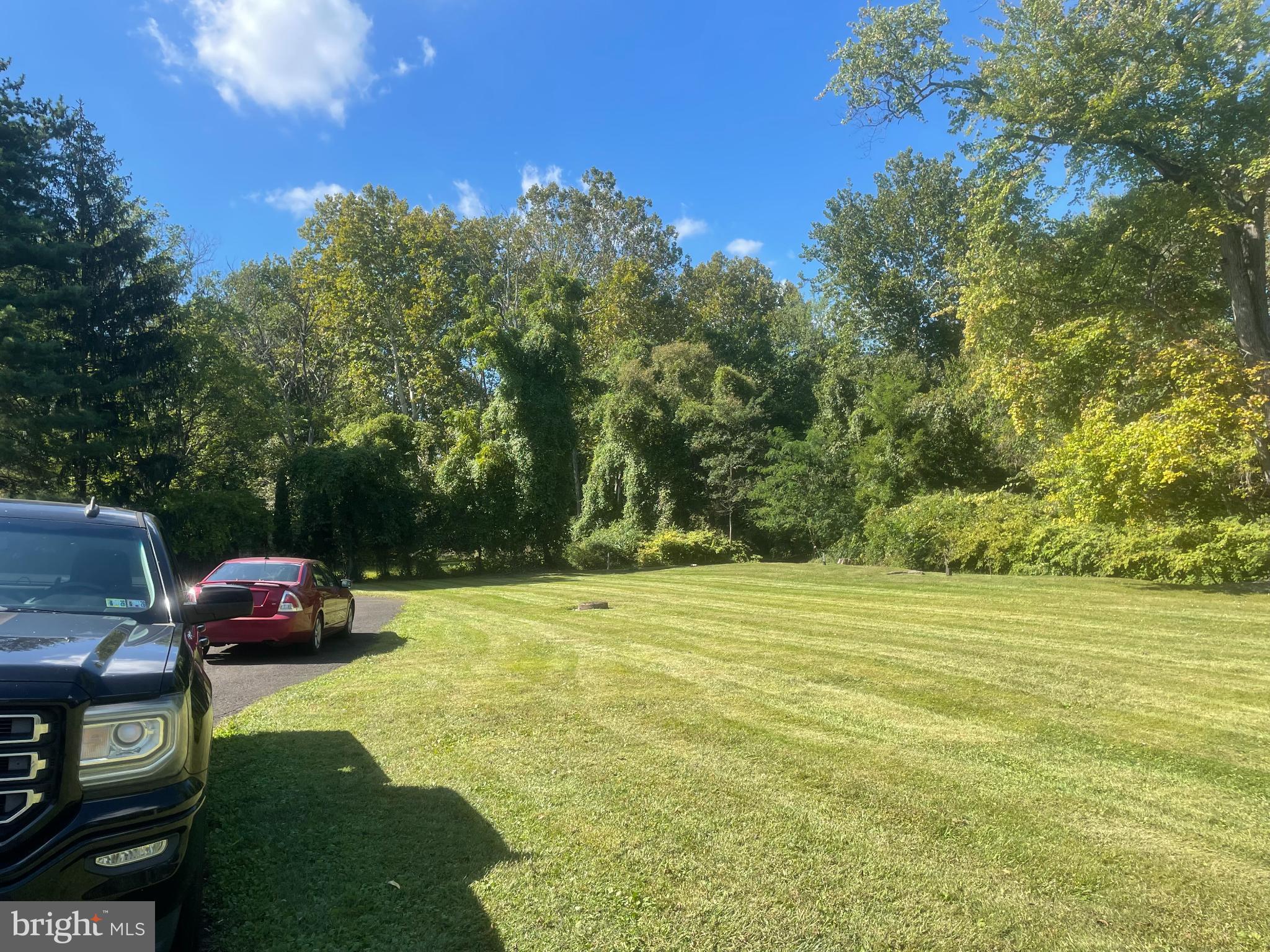404 Dresher Road, Unit G Horsham, PA 19044 - Photo 5 of 6 a car parked in the middle of a field
