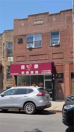 a front view of a building with parking