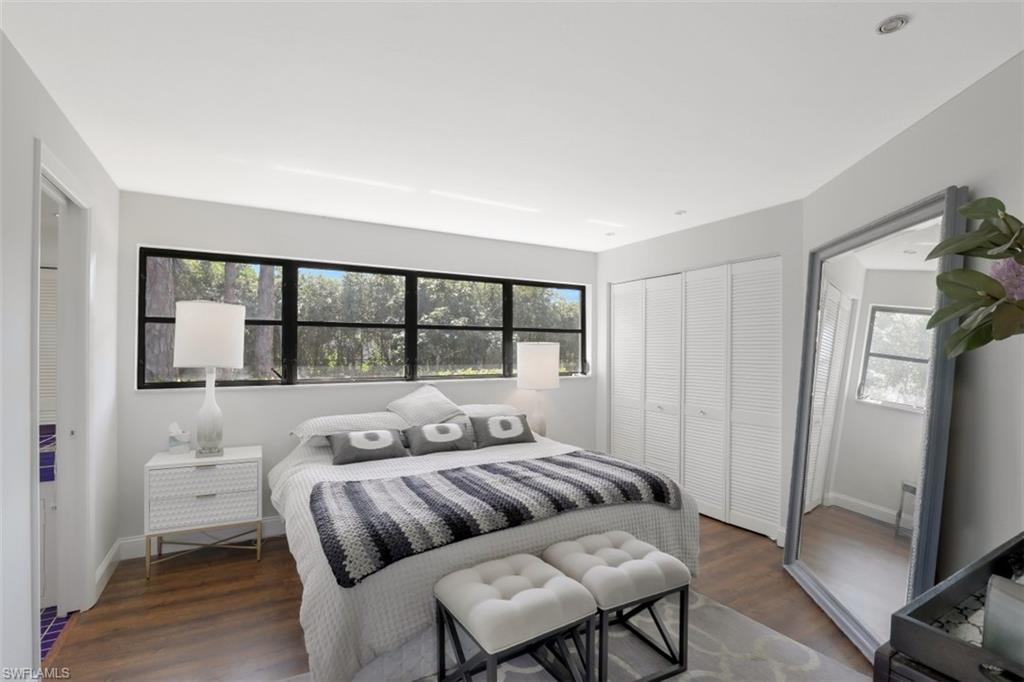 6640 Trail Boulevard Naples, FL 34108 - Photo 14 of 25 a bedroom with a bed and a window