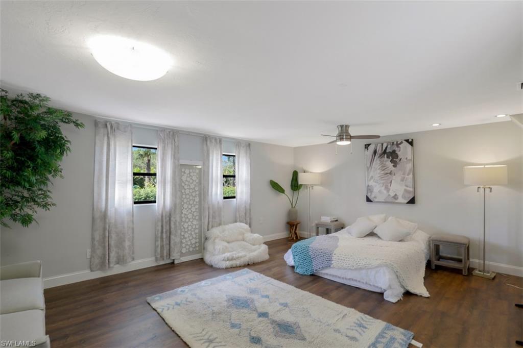 6640 Trail Boulevard Naples, FL 34108 - Photo 16 of 25 a bedroom with a bed and a window