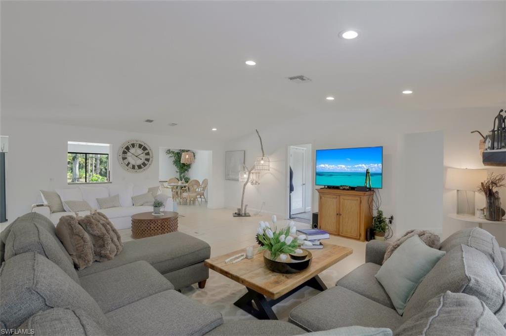 6640 Trail Boulevard Naples, FL 34108 - Photo 8 of 25 a living room with furniture and wooden floor