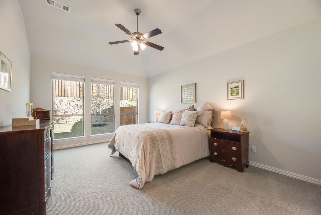227 Buffalo Boulevard Rhome, TX 76078 - Photo 18 of 39 a spacious bedroom with a bed and window
