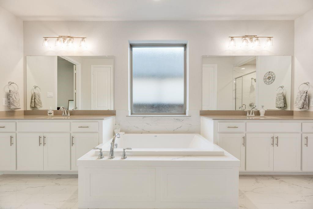 227 Buffalo Boulevard Rhome, TX 76078 - Photo 21 of 39 a bath room with a sink and a mirror