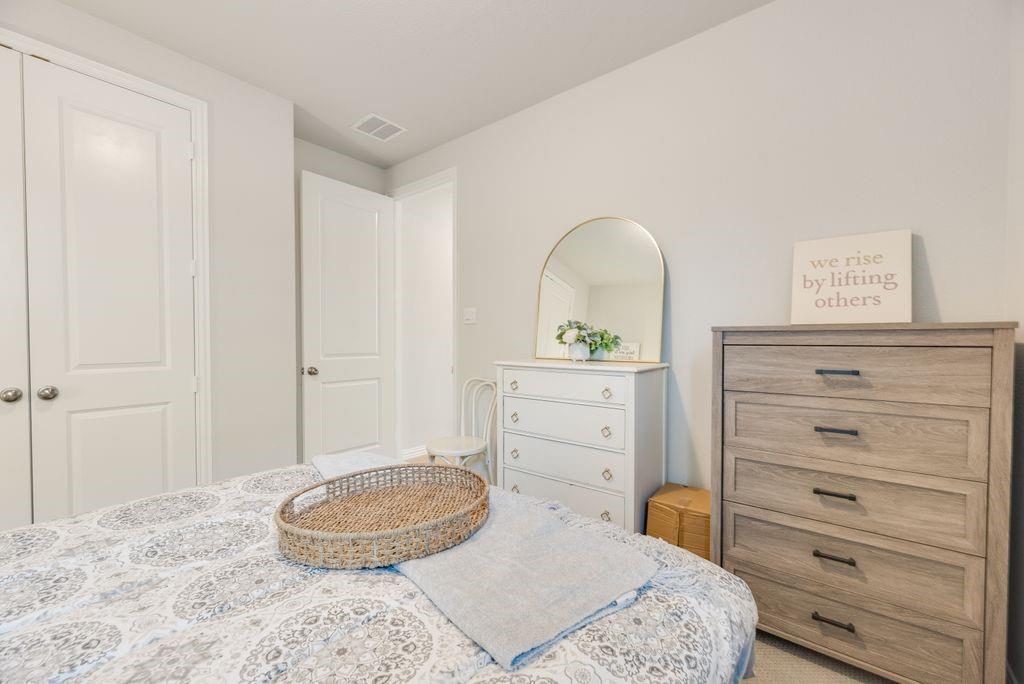 227 Buffalo Boulevard Rhome, TX 76078 - Photo 29 of 39 a bedroom with a bed and a dresser