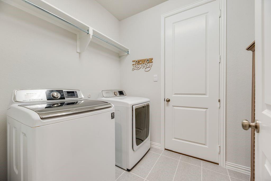 227 Buffalo Boulevard Rhome, TX 76078 - Photo 31 of 39 a utility room with dryer and washer