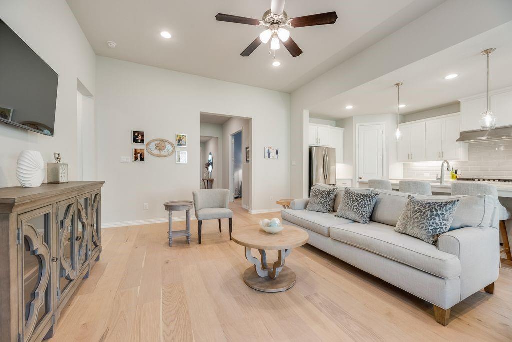 227 Buffalo Boulevard Rhome, TX 76078 - Photo 7 of 39 a living room with furniture and a flat screen tv