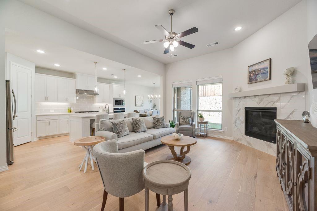 227 Buffalo Boulevard Rhome, TX 76078 - Photo 8 of 39 a living room with furniture kitchen and a fireplace
