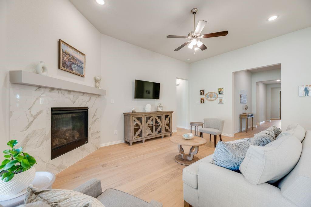 227 Buffalo Boulevard Rhome, TX 76078 - Photo 9 of 39 a living room with furniture and a fireplace