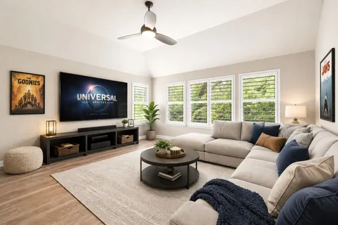 a living room with furniture a large window and a flat screen tv