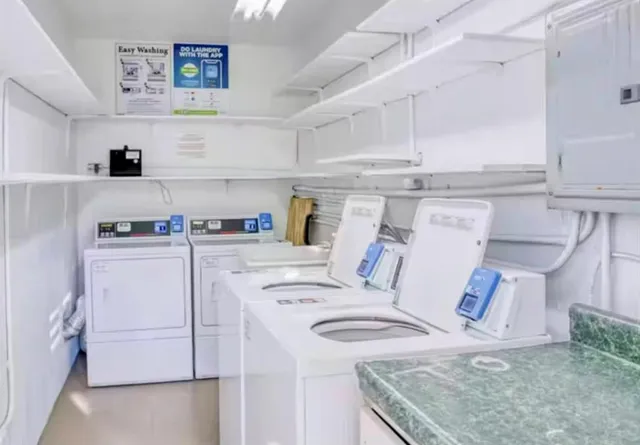 a front view of a house with a garden and patio