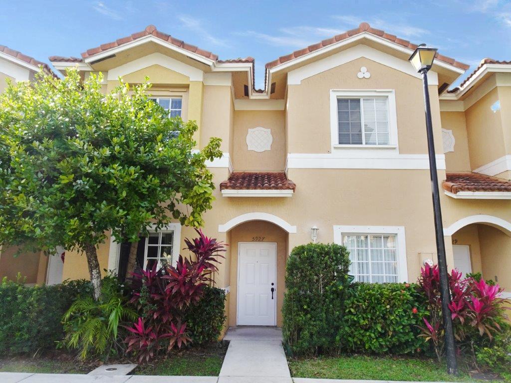 5927 Riverside Avenue Tamarac, FL 33321 - Photo 1 of 15 front view of a house