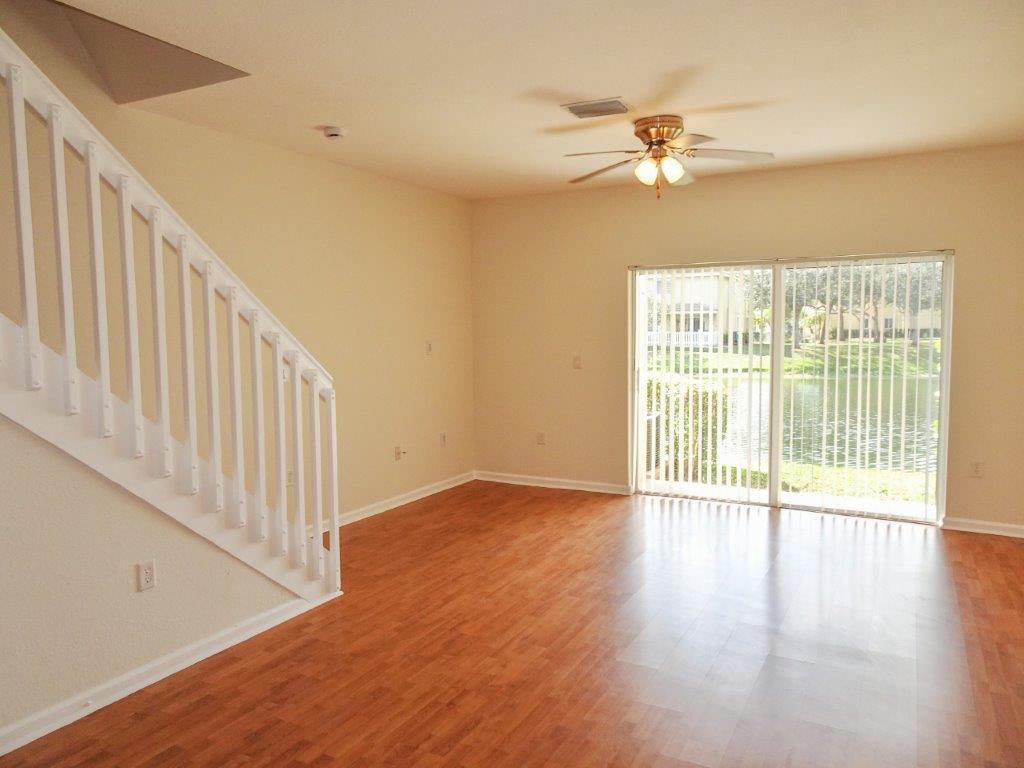 5927 Riverside Avenue Tamarac, FL 33321 - Photo 5 of 15 a view of an empty room with wooden floor and a window