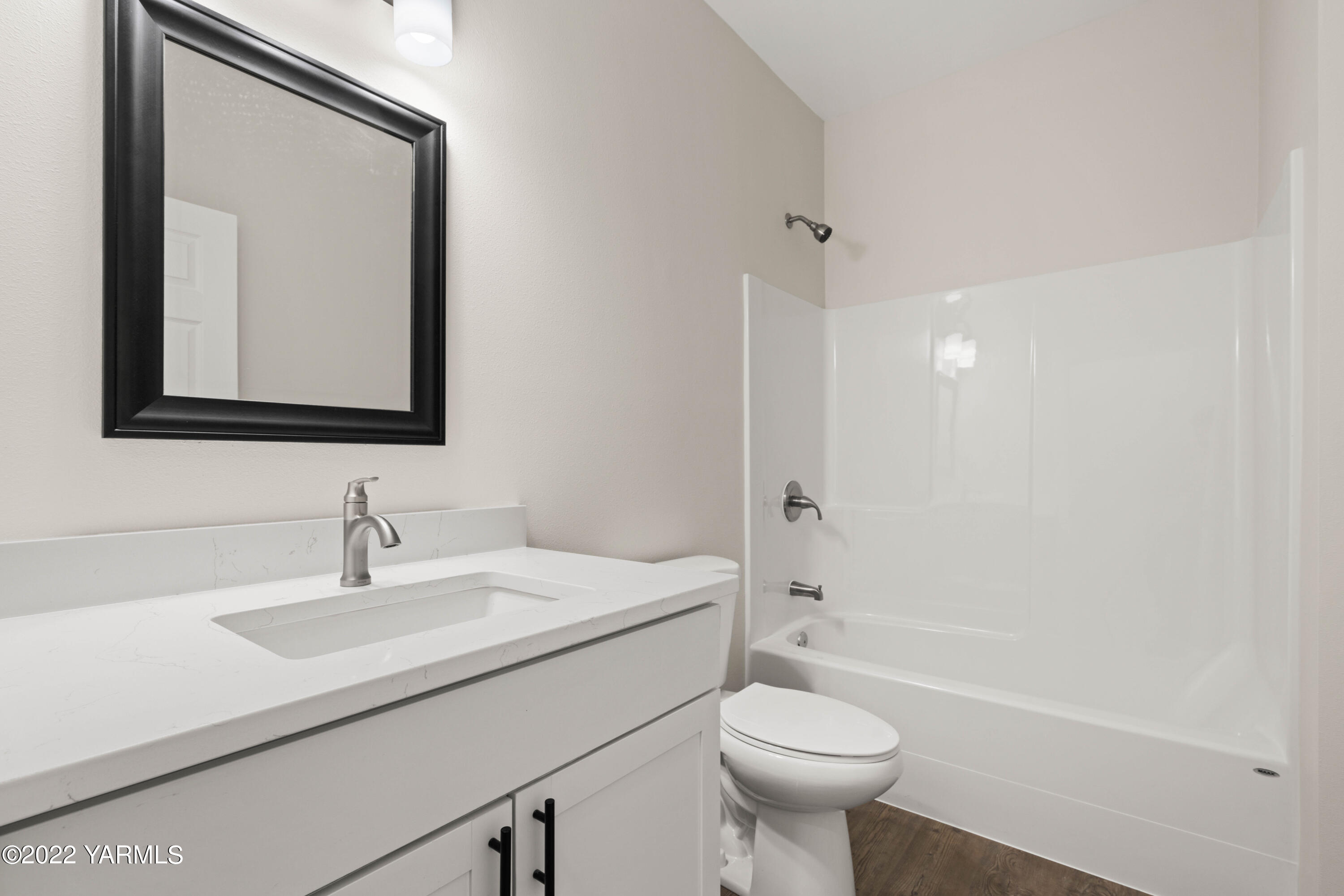 599 Bagley Road Granger, WA 98932 - Photo 6 of 13 a bathroom with a sink a toilet and a mirror