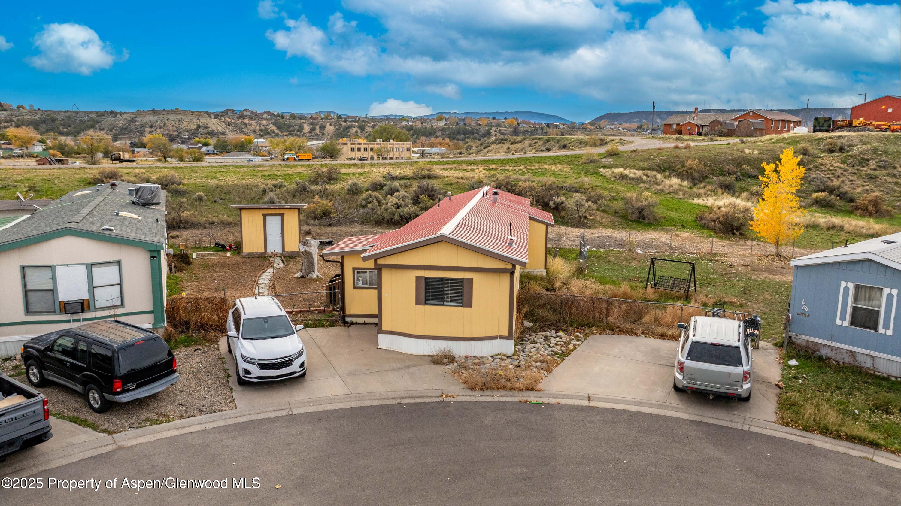 a view of a car park in front of a building