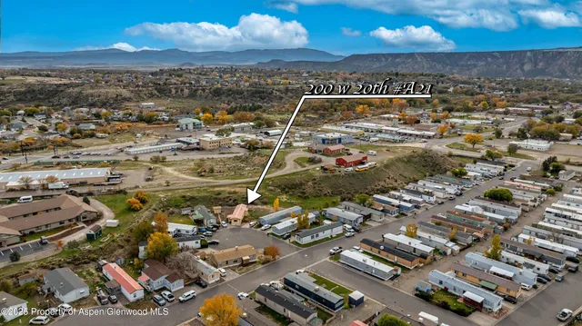 an aerial view of residential building with parking space