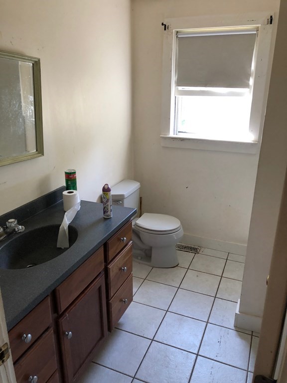 1 Wallace Drive Berkley, MA 02779 - Photo 5 of 8 a bath room with a sink a toilet and a mirror