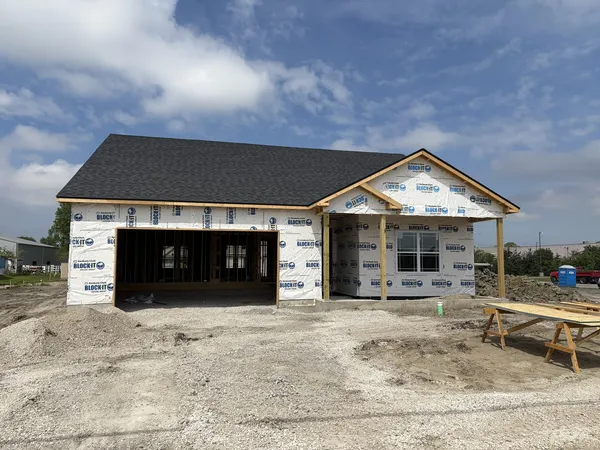 a front view of a house with garage
