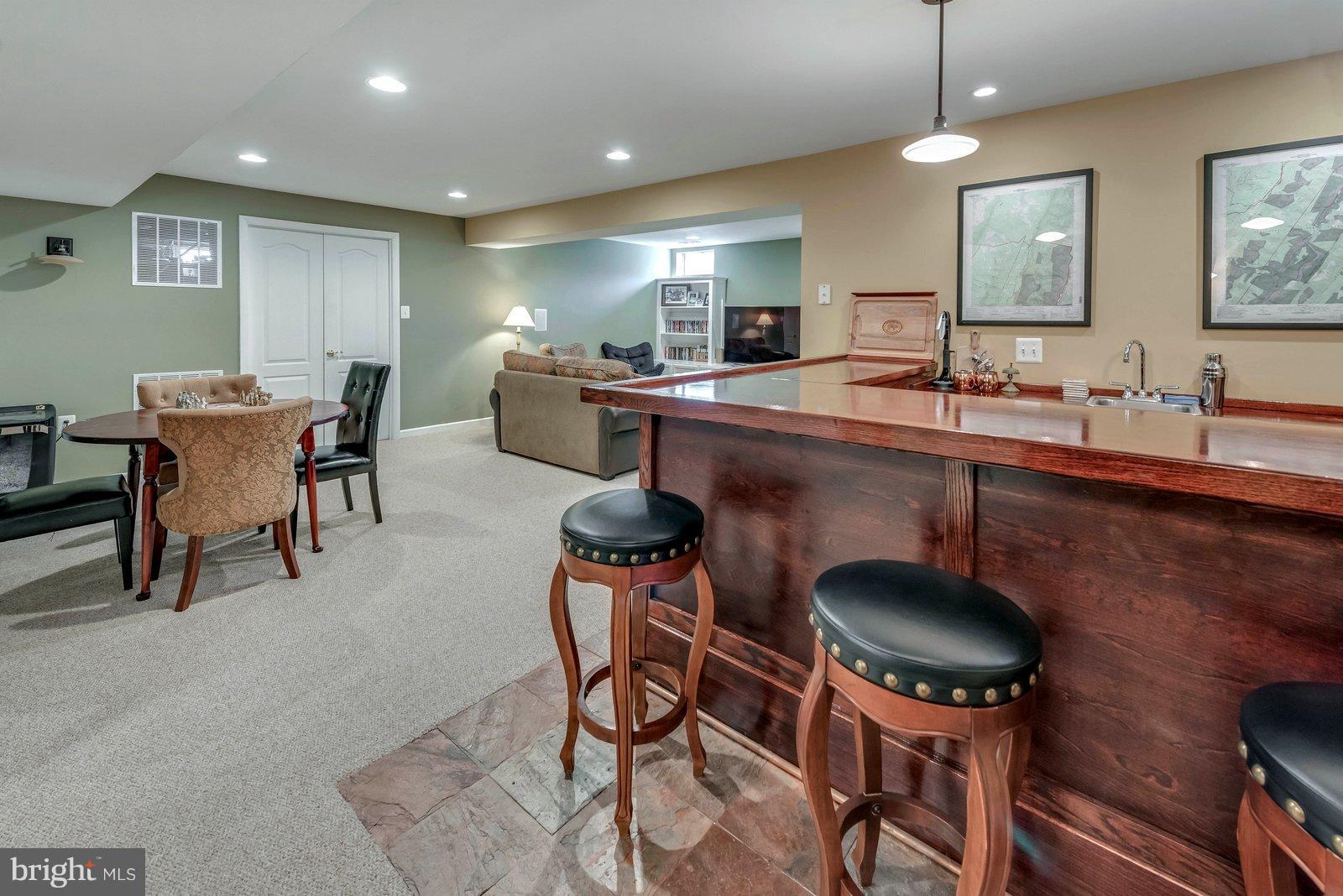 14404 Autumn Gold Road Boyds, MD 20841 - Photo 22 of 30 Finished bar area features refrigerator and water